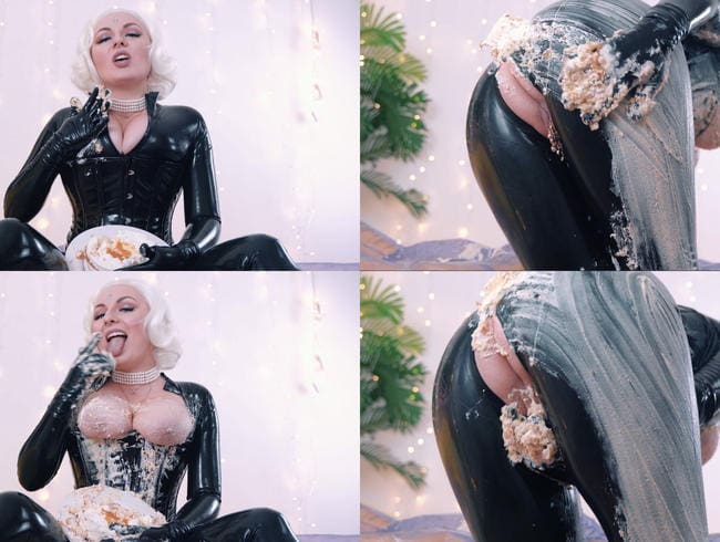 Slowly smearing the cake on the breasts and butt, all over the body, dressed in latex catsuit.